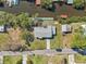 Aerial view of the property showcasing its private dock, waterside setting and proximity to surrounding neighborhood at 106 W North Branch Rd, Ruskin, FL 33570
