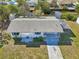 Aerial view of home featuring a dock and patio with covered parking at 106 W North Branch Rd, Ruskin, FL 33570