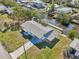 Aerial view of the property with a dock and canal access, lush greenery, and convenient waterfront living at 106 W North Branch Rd, Ruskin, FL 33570