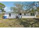 Back of house showing water access and trash receptacles at 106 W North Branch Rd, Ruskin, FL 33570