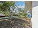 Lush backyard features a wooden dock on the water at 106 W North Branch Rd, Ruskin, FL 33570
