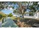 Spacious backyard with a wooden dock, leading to waterfront access at 106 W North Branch Rd, Ruskin, FL 33570