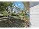 View of a waterfront backyard with a dock on the canal at 106 W North Branch Rd, Ruskin, FL 33570