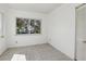 Bright room featuring tiled floors, large windows, and white walls at 106 W North Branch Rd, Ruskin, FL 33570