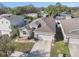 Aerial shot showcasing the home's roofline, driveway, and surrounding neighborhood at 10604 Scenic Hollow Dr, Riverview, FL 33578