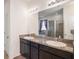 Bathroom with double vanity, granite countertop, and a glass shower at 10604 Scenic Hollow Dr, Riverview, FL 33578