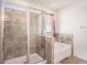 This bathroom features a glass shower stall and a bathtub at 10604 Scenic Hollow Dr, Riverview, FL 33578