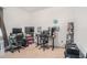 This home office features two workstations, shelving, and a neutral color scheme at 10604 Scenic Hollow Dr, Riverview, FL 33578
