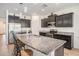 Kitchen showcasing granite countertops, stainless steel appliances, and a breakfast bar with seating at 10604 Scenic Hollow Dr, Riverview, FL 33578