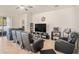 Living room featuring tile flooring, a ceiling fan, and comfortable leather seating at 10604 Scenic Hollow Dr, Riverview, FL 33578