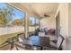 This screened-in patio features seating and views of the outdoors at 10604 Scenic Hollow Dr, Riverview, FL 33578
