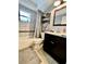 Bathroom featuring a shower-tub combo and modern vanity at 11248 115Th St, Seminole, FL 33778