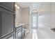 Bathroom featuring a modern vanity, sleek fixtures, and a spacious layout with tile floor at 12050 Stone Crossing Cir, Tampa, FL 33635