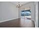 Dining room with chandelier and sliding glass doors leading to screened-in pool at 12050 Stone Crossing Cir, Tampa, FL 33635