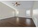 Bright living area with ceiling fan and wood-look floors at 12050 Stone Crossing Cir, Tampa, FL 33635