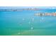 An aerial view showcasing boats sailing on the bay, with the nearby neighborhood visible at 13250 Ridge Rd # 10-4, Largo, FL 33778