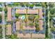 An aerial view of the community with a pool and parking. Located in a verdant setting at 13250 Ridge Rd # 10-4, Largo, FL 33778