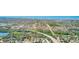 An aerial view showcases the community's proximity to nearby ponds and the highway at 13250 Ridge Rd # 10-4, Largo, FL 33778