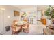 Cozy dining area seamlessly connects to the kitchen, featuring a breakfast bar and ample lighting at 13250 Ridge Rd # 10-4, Largo, FL 33778