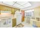 Cozy kitchen with classic appliances and a view to the yard at 13250 Ridge Rd # 10-4, Largo, FL 33778