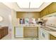This kitchen features a sink, dishwasher, and view to the living room at 13250 Ridge Rd # 10-4, Largo, FL 33778