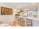 A kitchen featuring a breakfast bar with seating for three at 13250 Ridge Rd # 10-4, Largo, FL 33778