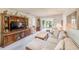 Bright living room with large windows, comfortable seating, and stylish decor at 13250 Ridge Rd # 10-4, Largo, FL 33778