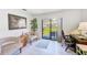 Bright living area with comfortable seating and a sliding door to the outside at 13250 Ridge Rd # 10-4, Largo, FL 33778