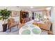 The open floor plan living and dining area has carpeted floors and plenty of natural light at 13250 Ridge Rd # 10-4, Largo, FL 33778
