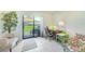 Bright office space with tile flooring, a comfortable chair, and sliding glass door access at 13250 Ridge Rd # 10-4, Largo, FL 33778