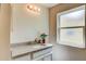 Bathroom features a granite countertop, modern sink, stylish light fixture, and a window for natural light at 14334 Channel Dr, Largo, FL 33774