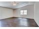 Vaulted-ceiling bedroom featuring hardwood floors and a window for natural light and ventilation at 14334 Channel Dr, Largo, FL 33774