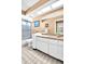 Bathroom with a shower, toilet and vanity with a decorative backsplash and tile floor at 1434 Glengarry Dr, Palm Harbor, FL 34684