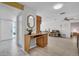 Foyer with desk and mirror that leads to the living area and bedroom at 1434 Glengarry Dr, Palm Harbor, FL 34684