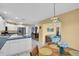 Eat-in kitchen with white cabinets, stainless steel appliances, and a breakfast nook at 1434 Glengarry Dr, Palm Harbor, FL 34684