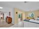Bright eat-in kitchen that features a bar top and backyard access through sliding glass doors at 1434 Glengarry Dr, Palm Harbor, FL 34684
