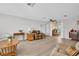 Large living room featuring new floors, ceiling fan, and lots of natural light at 1434 Glengarry Dr, Palm Harbor, FL 34684