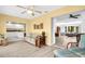 Open-concept living room with views into the kitchen and second living area at 1434 Glengarry Dr, Palm Harbor, FL 34684