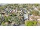 Aerial view of neighborhood homes with mature trees and well-manicured lawns at 15530 Morgan St, Clearwater, FL 33760