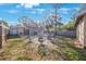 Showing the Large backyard, patio, shed, and seating around firepit at 15530 Morgan St, Clearwater, FL 33760