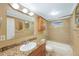 Well-maintained bathroom with a granite countertop and a tub-shower combo at 15530 Morgan St, Clearwater, FL 33760