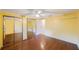 Comfortable bedroom with mirrored closet doors and hardwood flooring at 15530 Morgan St, Clearwater, FL 33760