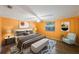 Stylish bedroom with a large bed, modern furniture, and bright colors at 15530 Morgan St, Clearwater, FL 33760