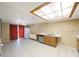 Eat-in kitchen with white cabinets, tile floor, and access to the backyard at 15530 Morgan St, Clearwater, FL 33760