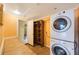 Convenient laundry room features a stacked washer and dryer at 15530 Morgan St, Clearwater, FL 33760
