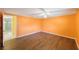 Bright living room with laminate floors and a ceiling fan at 15530 Morgan St, Clearwater, FL 33760