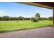 Backyard featuring a brick patio, grassy area and greenery at 15708 Oakleaf Run Dr, Lithia, FL 33547