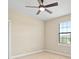 Bright bedroom with a large window, ceiling fan and neutral walls at 15708 Oakleaf Run Dr, Lithia, FL 33547