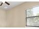 Bedroom featuring a window with blinds, neutral colored walls, and carpet flooring at 15708 Oakleaf Run Dr, Lithia, FL 33547