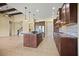 Kitchen with an island, stainless steel appliances, and an open floor plan at 15708 Oakleaf Run Dr, Lithia, FL 33547